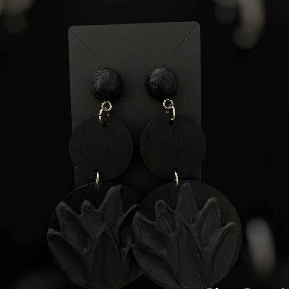 NWOT Hand crafted ,sculptured earrings with stainless steel accents.